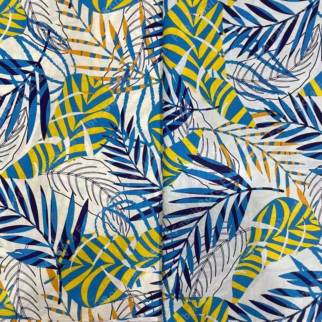 Abstract palm fronds cotton poplin fabric in blue and yellow