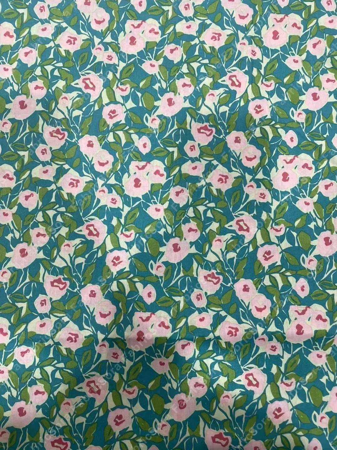 Mini camellia cotton poplin with teal and red grounds