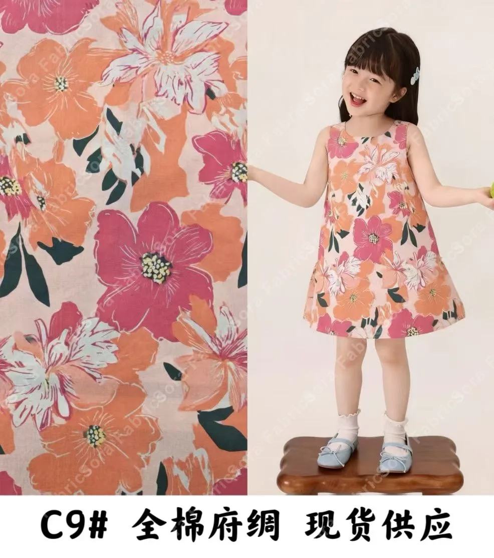 Tissu coton popeline à boutons de rose dans des couleurs douces