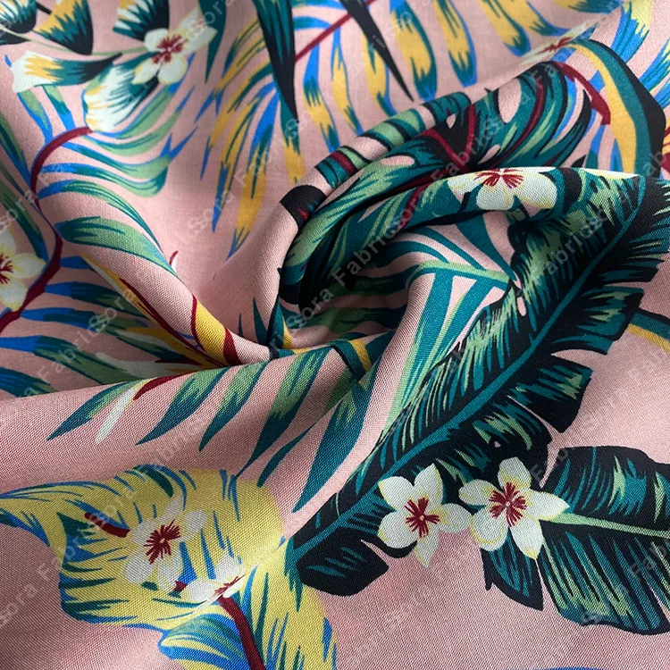 Frangipani and bird-of-paradise rayon fabric in vivid colors